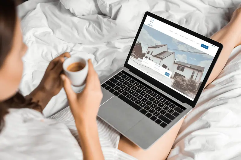 Cosy Spoons website shown on a laptop
