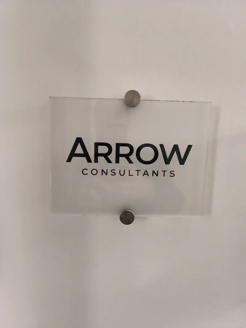 Arrow Consultants Plexiglas plaque fixed to the wall