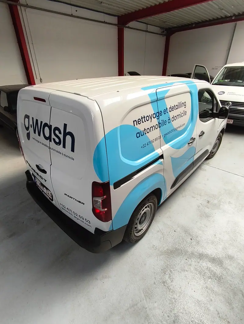 G-wash van with a white and blue wrap