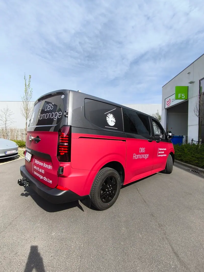 Red and black van with the DBS Ramonage logo