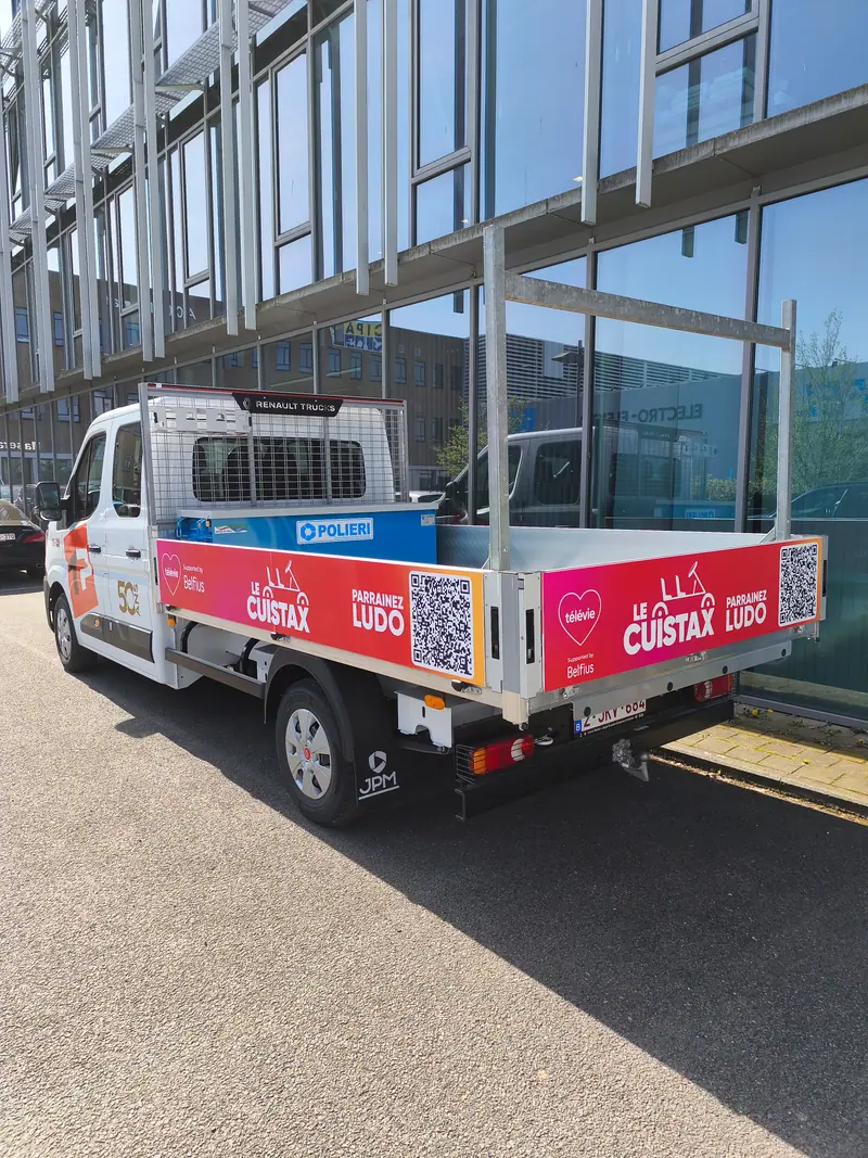 Flatbed van in Le Cuistax colours with red banners and QR codes