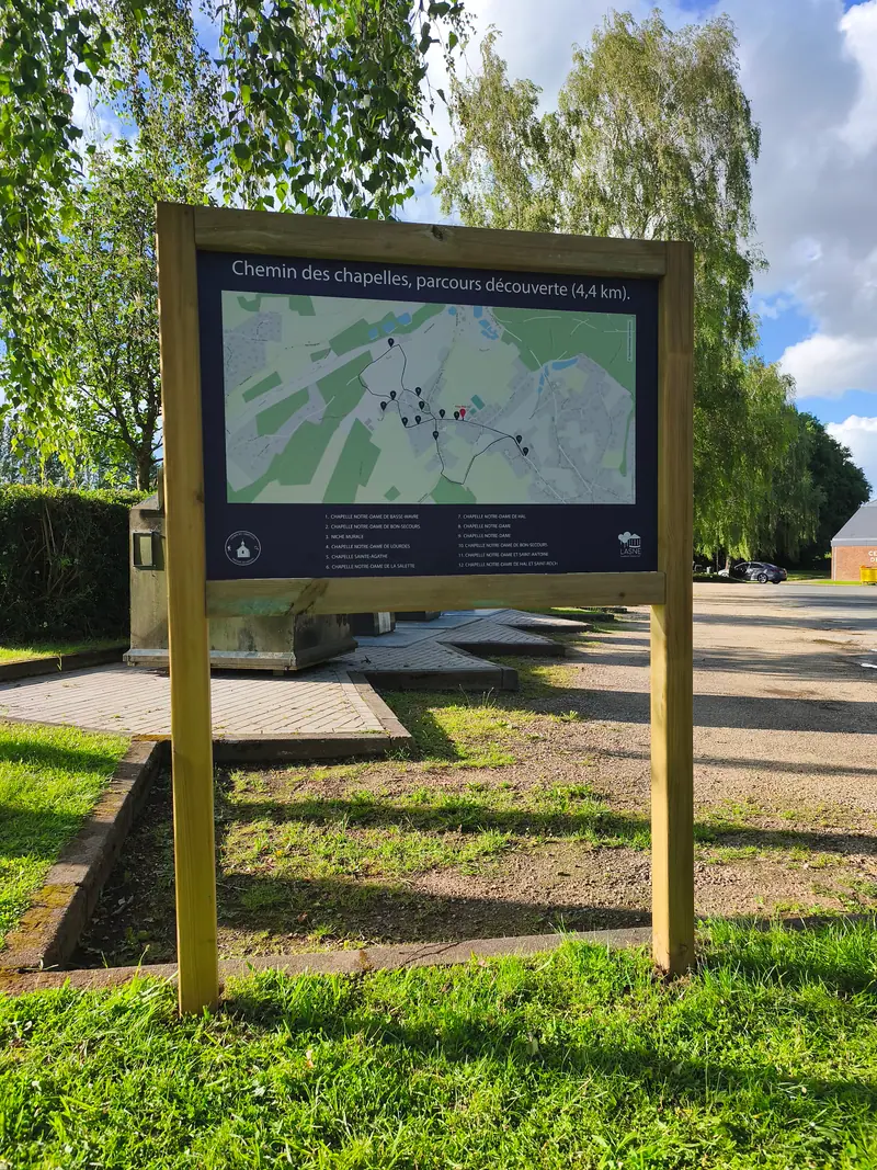 Outdoor information panel with a map of the chemin des chapelles