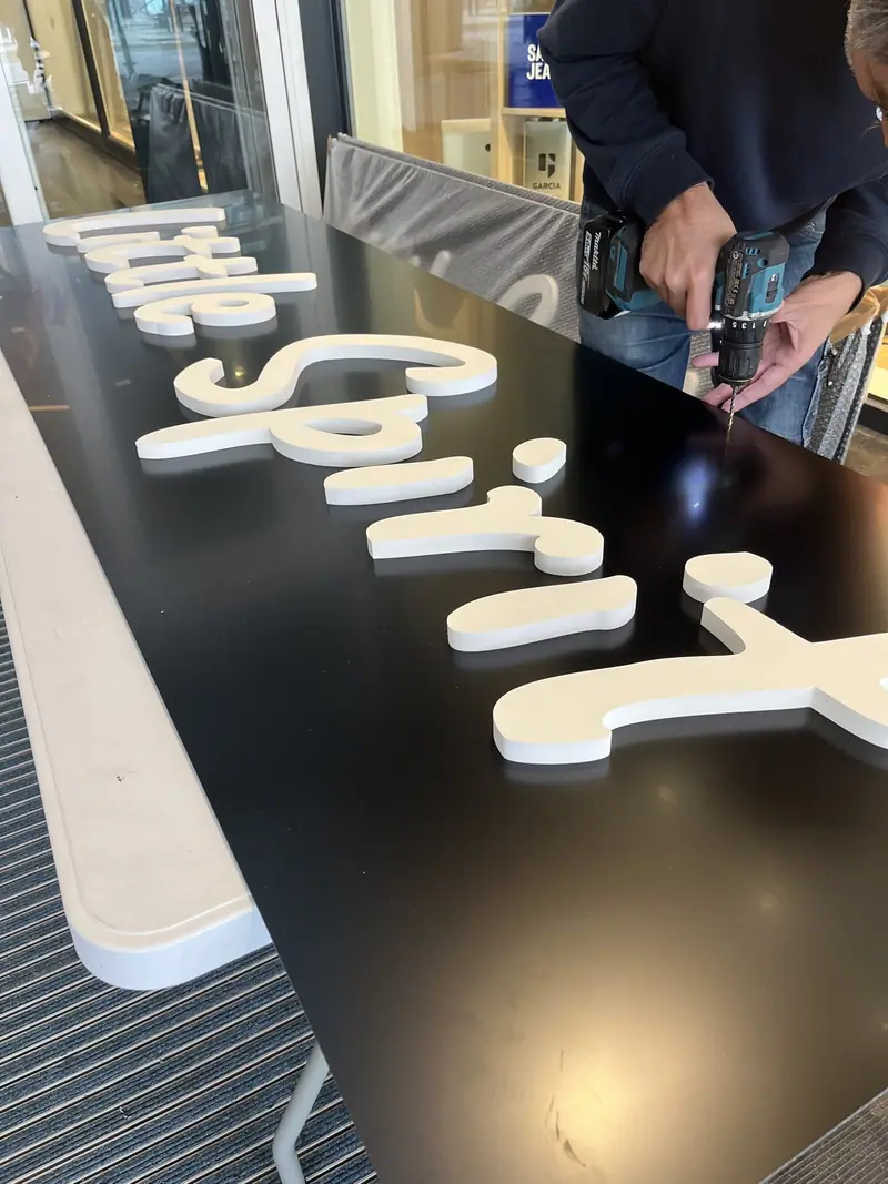 Raised Little Spirit letters laid flat before installation